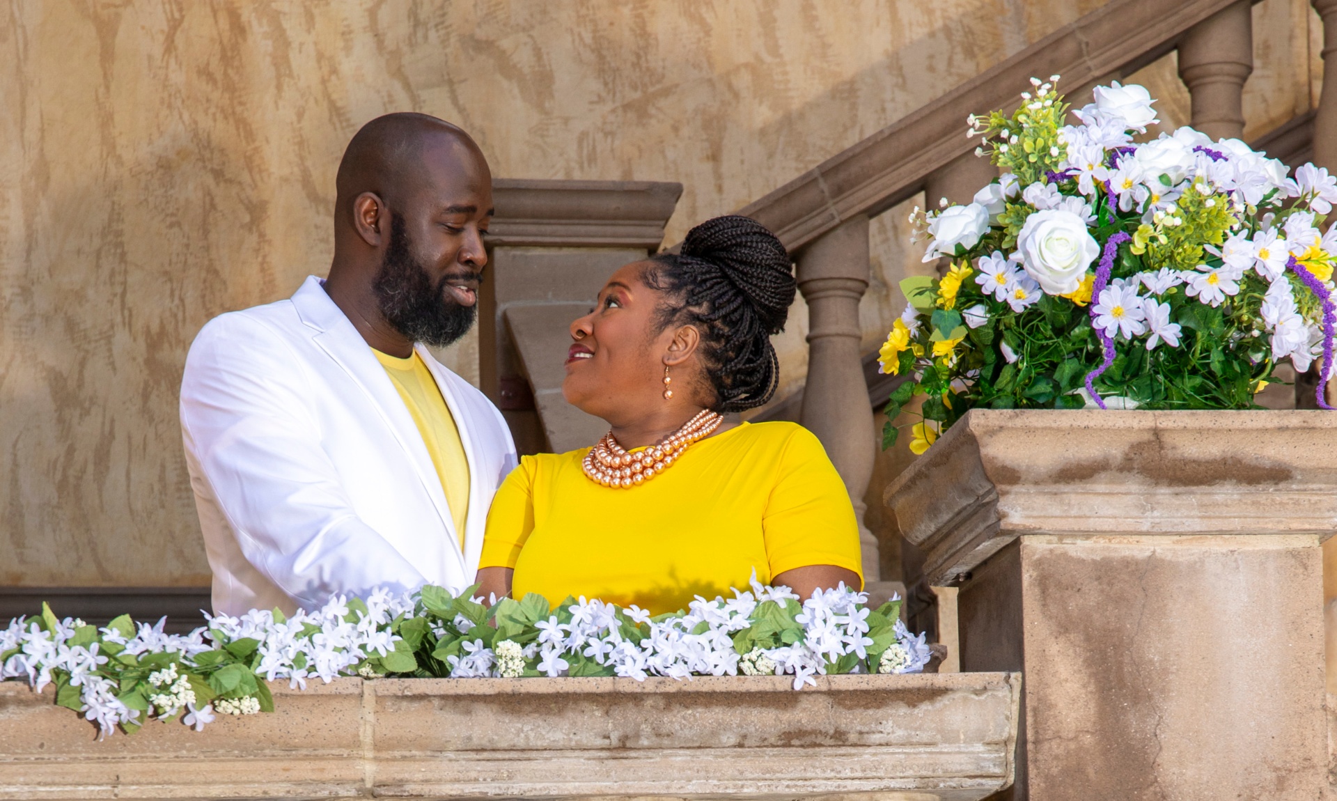 Boris and Marion on a balcony with flowers