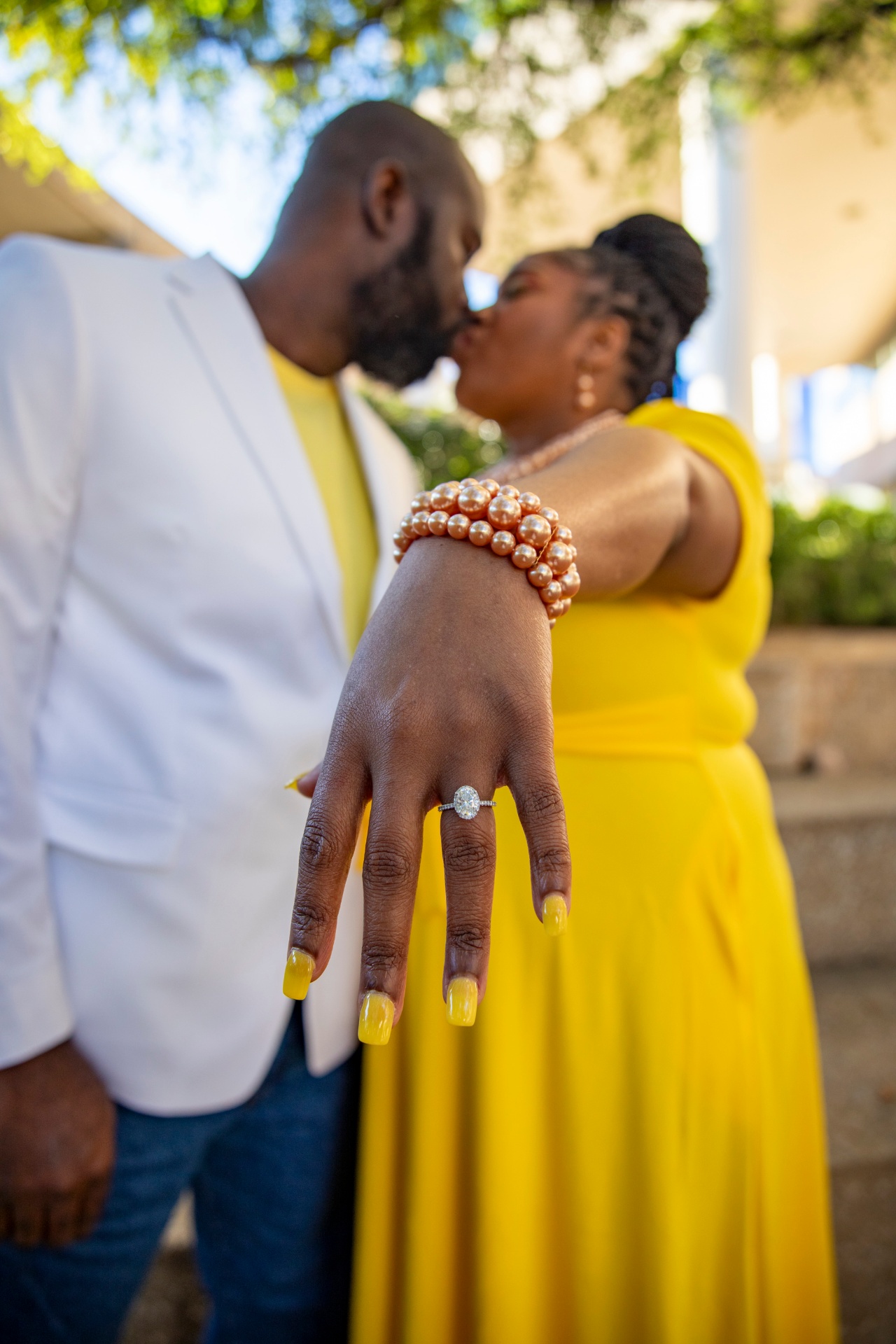 Marion's engagement ring with pearl bracelet